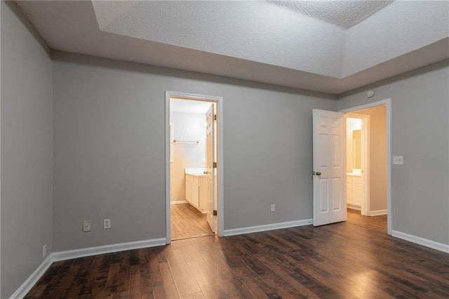 5069 Jonesboro Rd, Union City, GA 30291 - unfurnished bedroom with dark wood-style flooring and ensuite bathroom