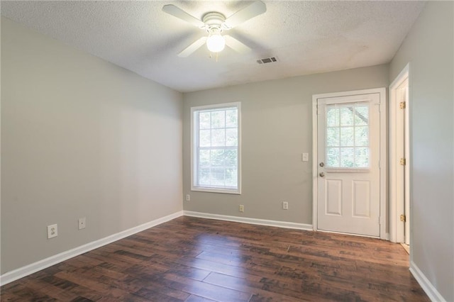 5069 Jonesboro Rd, Union City, GA 30291 - foyer featuring healthy amount of natural light, dark wood-style flooring, a textured ceiling, and a ceiling fan