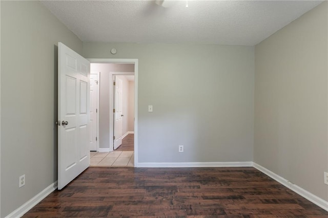 5069 Jonesboro Rd, Union City, GA 30291 - empty room with wood finished floors, a textured ceiling, and a ceiling fan