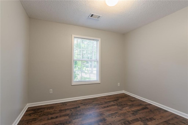 5069 Jonesboro Rd, Union City, GA 30291 - empty room featuring dark wood-style flooring and a textured ceiling