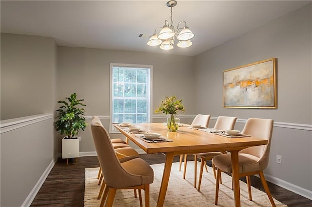 5069 Jonesboro Rd, Union City, GA 30291 - dining space with dark wood-type flooring and a chandelier