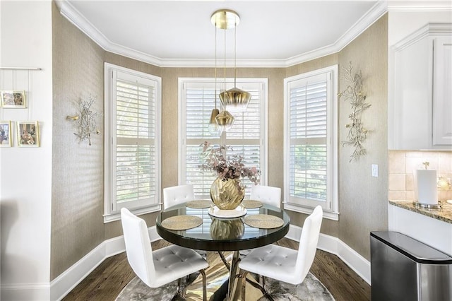 dining room with baseboards, ornamental molding, and dark wood-style flooring