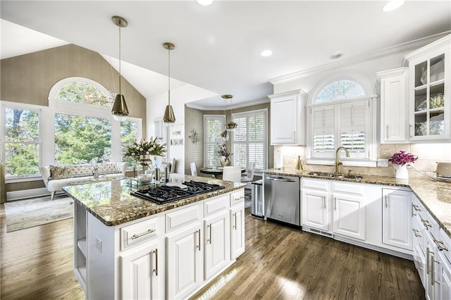 kitchen featuring dishwasher, dark wood-type flooring, black gas cooktop, vaulted ceiling, and a sink