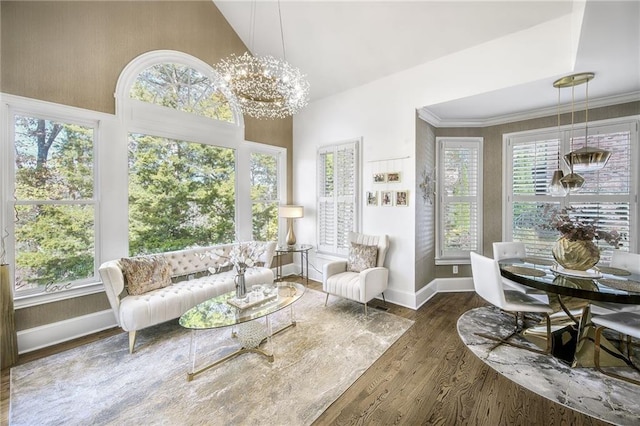 sunroom / solarium with a chandelier and plenty of natural light