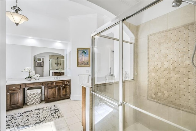 bathroom featuring a stall shower, vanity, and tile patterned floors