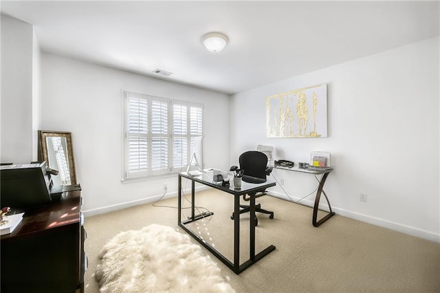 office with carpet, visible vents, and baseboards