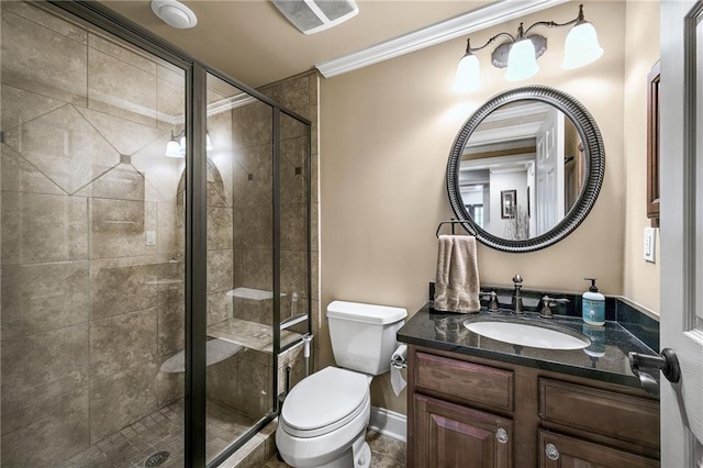 full bath with a stall shower, vanity, toilet, and crown molding