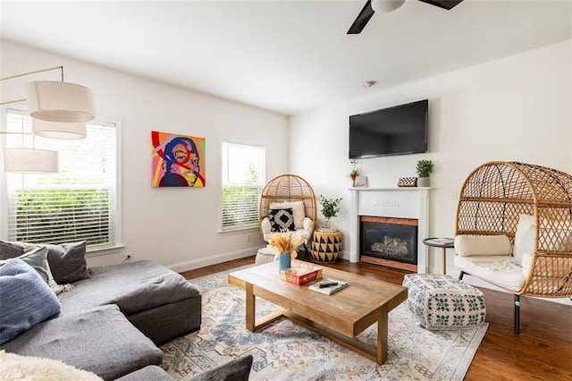 living room with ceiling fan and light hardwood / wood-style floors