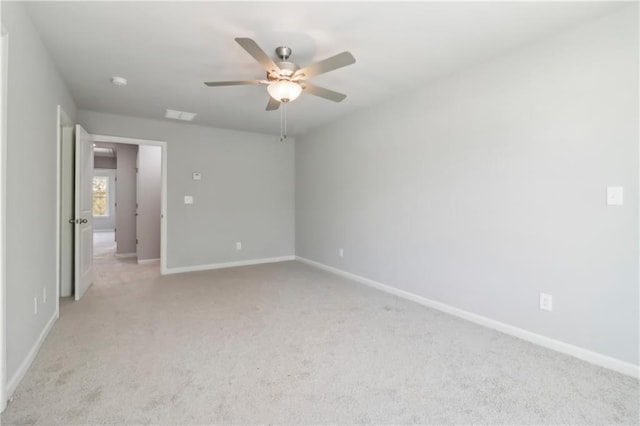 unfurnished bedroom featuring light carpet and ceiling fan