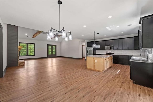 2462 New Hope Rd, Morganton, GA 30560 - kitchen featuring appliances with stainless steel finishes, a sink, open floor plan, light wood-style floors, and recessed lighting