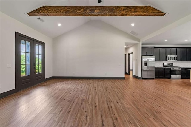 2462 New Hope Rd, Morganton, GA 30560 - unfurnished living room featuring light wood-type flooring, french doors, recessed lighting, baseboards, and lofted ceiling