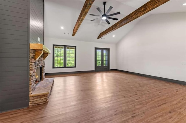 2462 New Hope Rd, Morganton, GA 30560 - unfurnished living room with beam ceiling, a fireplace, ceiling fan, wood finished floors, and high vaulted ceiling