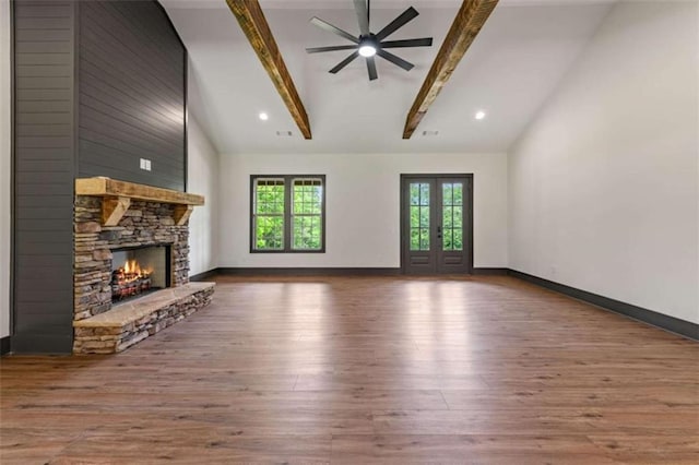 2462 New Hope Rd, Morganton, GA 30560 - unfurnished living room with beamed ceiling, wood finished floors, ceiling fan, a fireplace, and baseboards