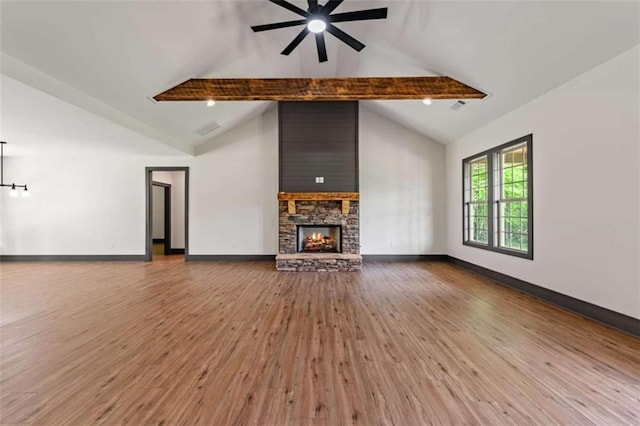 2462 New Hope Rd, Morganton, GA 30560 - unfurnished living room with wood finished floors, beamed ceiling, ceiling fan, a fireplace, and baseboards