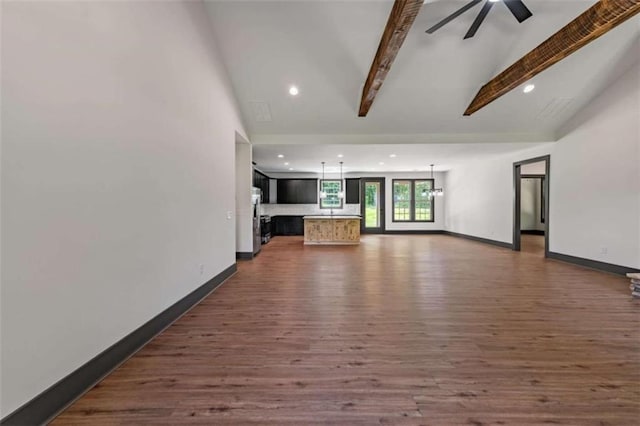 2462 New Hope Rd, Morganton, GA 30560 - unfurnished living room featuring recessed lighting, beamed ceiling, dark wood-type flooring, ceiling fan, and baseboards