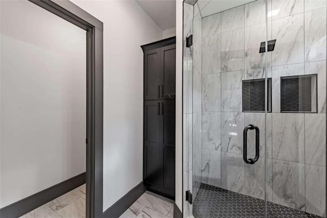 2462 New Hope Rd, Morganton, GA 30560 - bathroom featuring marble look tile flooring, baseboards, and a stall shower