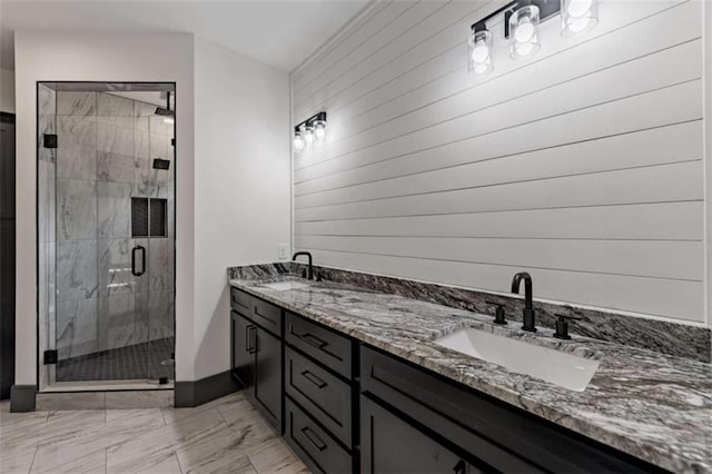 2462 New Hope Rd, Morganton, GA 30560 - bathroom with a shower stall, marble finish floors, double vanity, wood walls, and baseboards