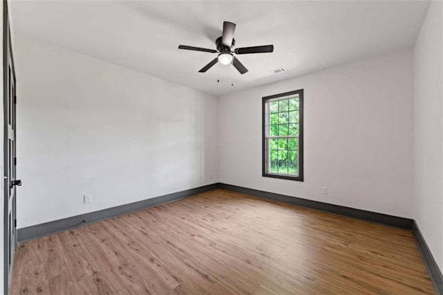2462 New Hope Rd, Morganton, GA 30560 - spare room with wood finished floors, baseboards, and a ceiling fan