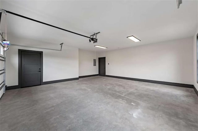 2462 New Hope Rd, Morganton, GA 30560 - garage with baseboards and a garage door opener
