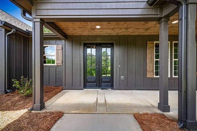 2462 New Hope Rd, Morganton, GA 30560 - view of exterior entry with french doors and board and batten siding