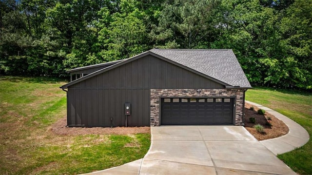 2462 New Hope Rd, Morganton, GA 30560 - view of property exterior featuring board and batten siding, concrete driveway, a lawn, and a garage
