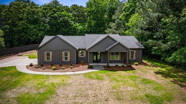 2462 New Hope Rd, Morganton, GA 30560 - single story home featuring board and batten siding, driveway, a front yard, and covered porch