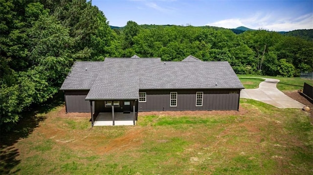 2462 New Hope Rd, Morganton, GA 30560 - back of property with a patio area, a wooded view, and a yard