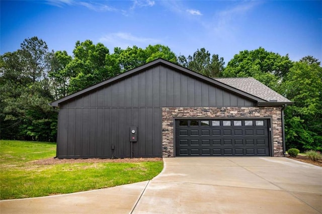 2462 New Hope Rd, Morganton, GA 30560 - view of home's exterior with concrete driveway, roof with shingles, a yard, and an attached garage