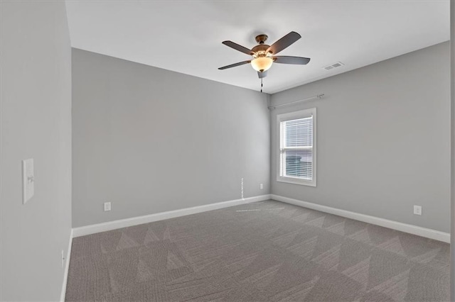 unfurnished room featuring carpet and ceiling fan