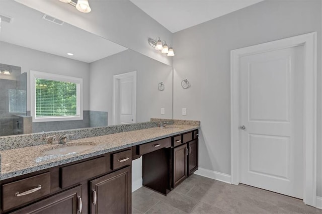 bathroom with vanity and an enclosed shower