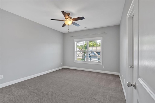 spare room with carpet flooring and ceiling fan