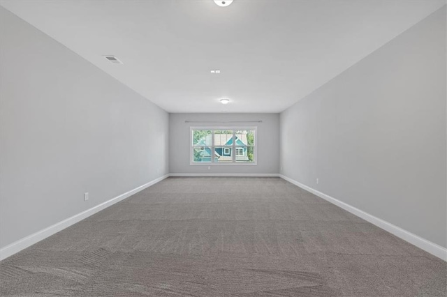 unfurnished room featuring light colored carpet