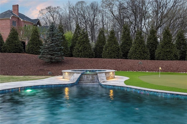 view of pool with an in ground hot tub