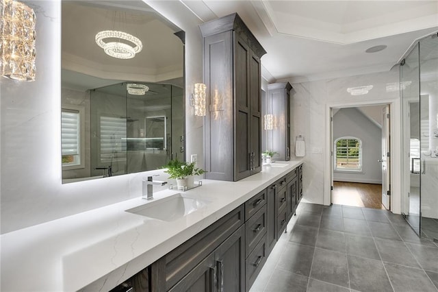 bathroom with tile patterned flooring, vanity, an enclosed shower, and crown molding