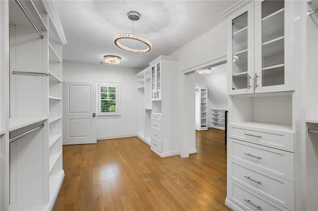 walk in closet featuring light hardwood / wood-style floors