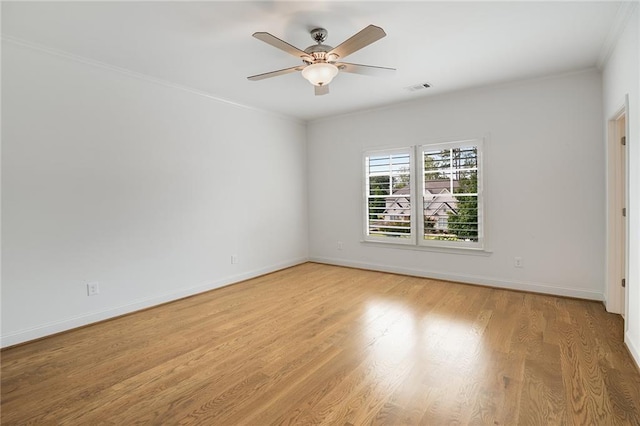 unfurnished room with crown molding, light hardwood / wood-style floors, and ceiling fan