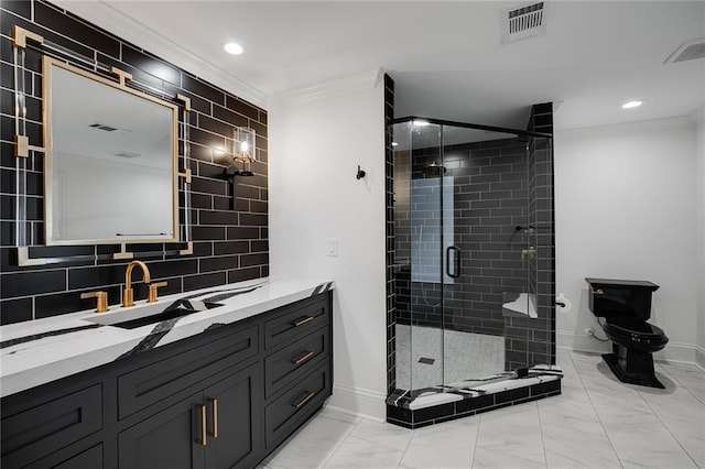 bathroom featuring toilet, tasteful backsplash, ornamental molding, vanity, and a shower with door