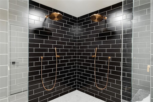 bathroom with tiled shower