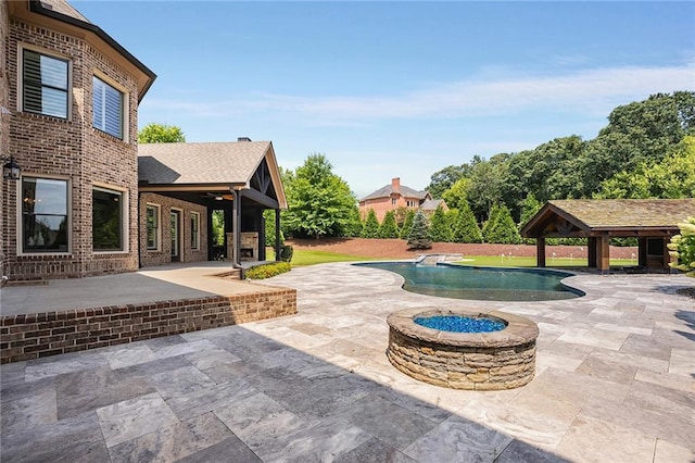 view of patio / terrace with a gazebo and an outdoor fire pit