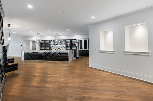 bedroom with hardwood / wood-style floors and ornamental molding