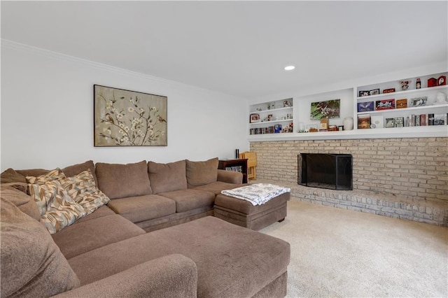 carpeted living room with a brick fireplace, built in shelves, and ornamental molding