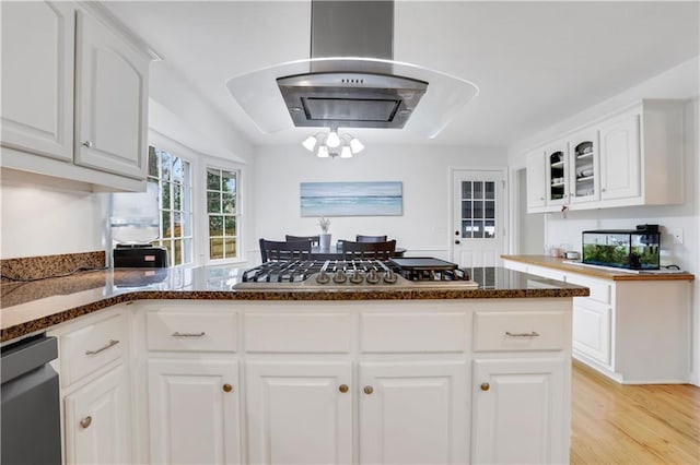 kitchen with dishwasher, range hood, white cabinets, stainless steel gas stovetop, and light wood-type flooring