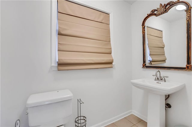 bathroom featuring tile patterned floors, toilet, and sink