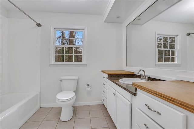 full bathroom with vanity, toilet, tile patterned flooring, and plenty of natural light