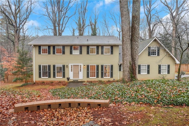 colonial-style house featuring a patio