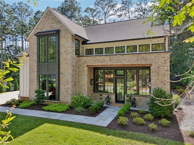 477 Michael Dr, Alpharetta, GA 30009 - view of front of property with a front yard, brick siding, and a shingled roof