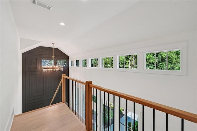 477 Michael Dr, Alpharetta, GA 30009 - corridor featuring recessed lighting, vaulted ceiling, a chandelier, and wood finished floors