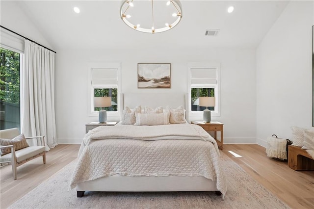 477 Michael Dr, Alpharetta, GA 30009 - bedroom with light wood-style floors, a chandelier, recessed lighting, and lofted ceiling