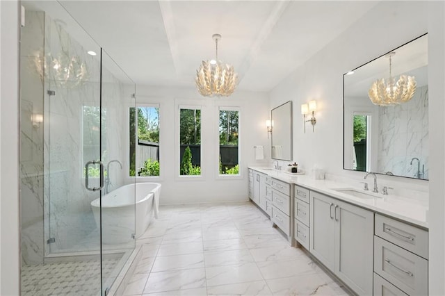 477 Michael Dr, Alpharetta, GA 30009 - full bath featuring a chandelier, plenty of natural light, and marble finish flooring