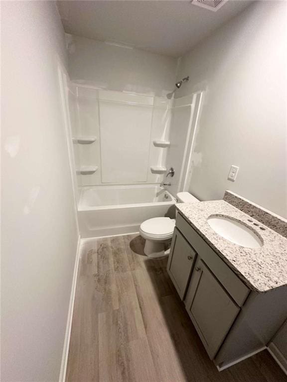 45 Emerald Ln, Covington, GA 30014 - full bath featuring wood finished floors, vanity, toilet, and shower / tub combination